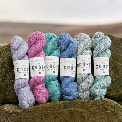 The latest selection of the beautiful croft colours (left to right) Clate, Bressay, Samfrey, Whalsay, Eastshore and Hoswick propped up against a rock with Shetland in the background. 