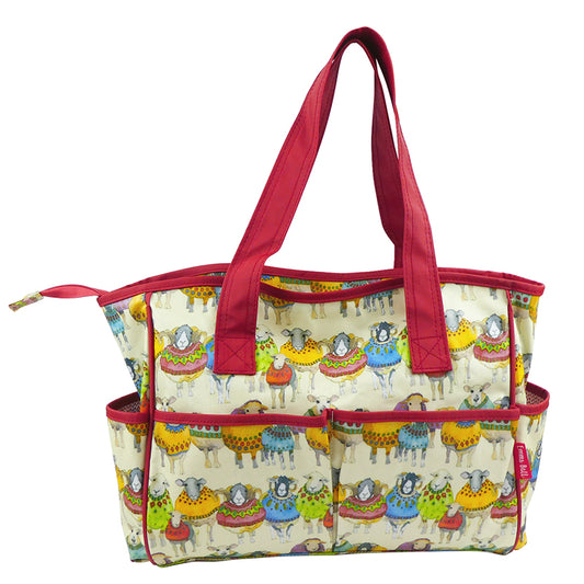 Picture of exterior of Large pocket bag. Sheep in Sweaters pattern covers all of it and the ribbing and handles are made of red fabric