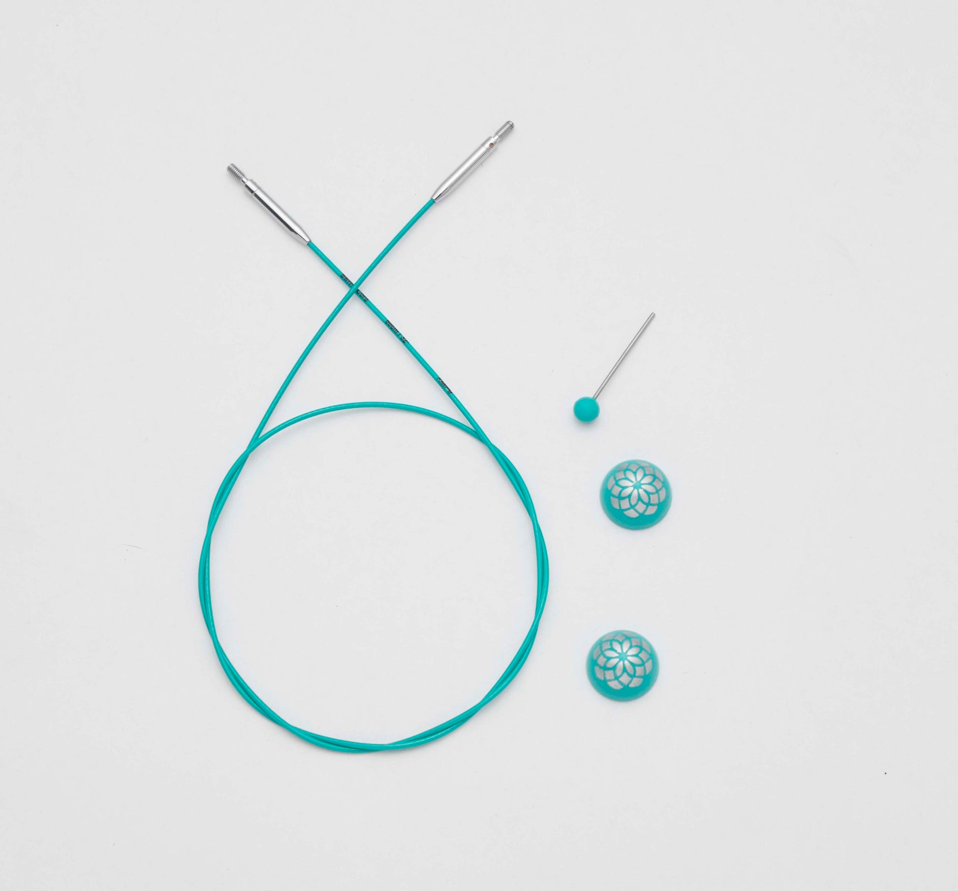 Teal coloured Knit Pro cables