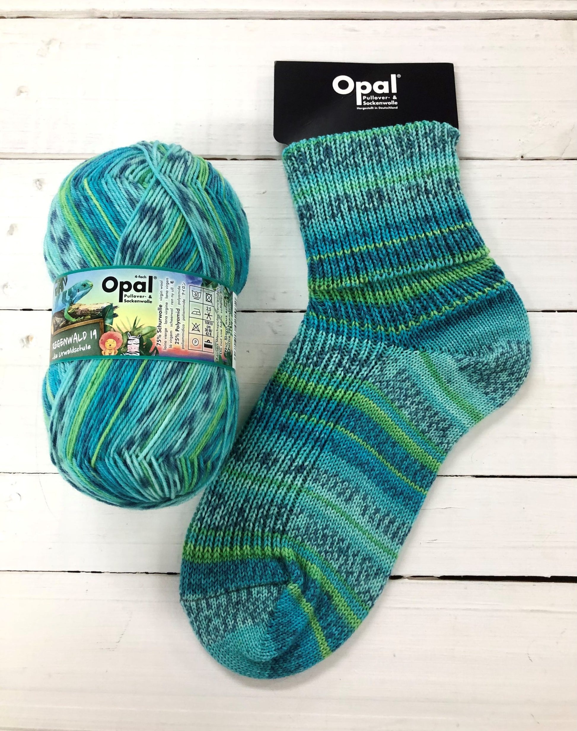 11337 - Bright teal, turquoise and green self striping sock with grey speckle.