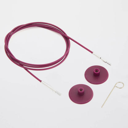 Example of Purple KnitPro Cable for interchangeable circular needles. Photo also features purple cable caps and a key for tightening the needles.