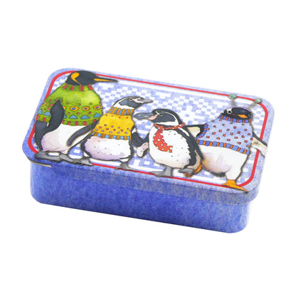 Miniature light blue tin with penguins in pullovers design on lid and.