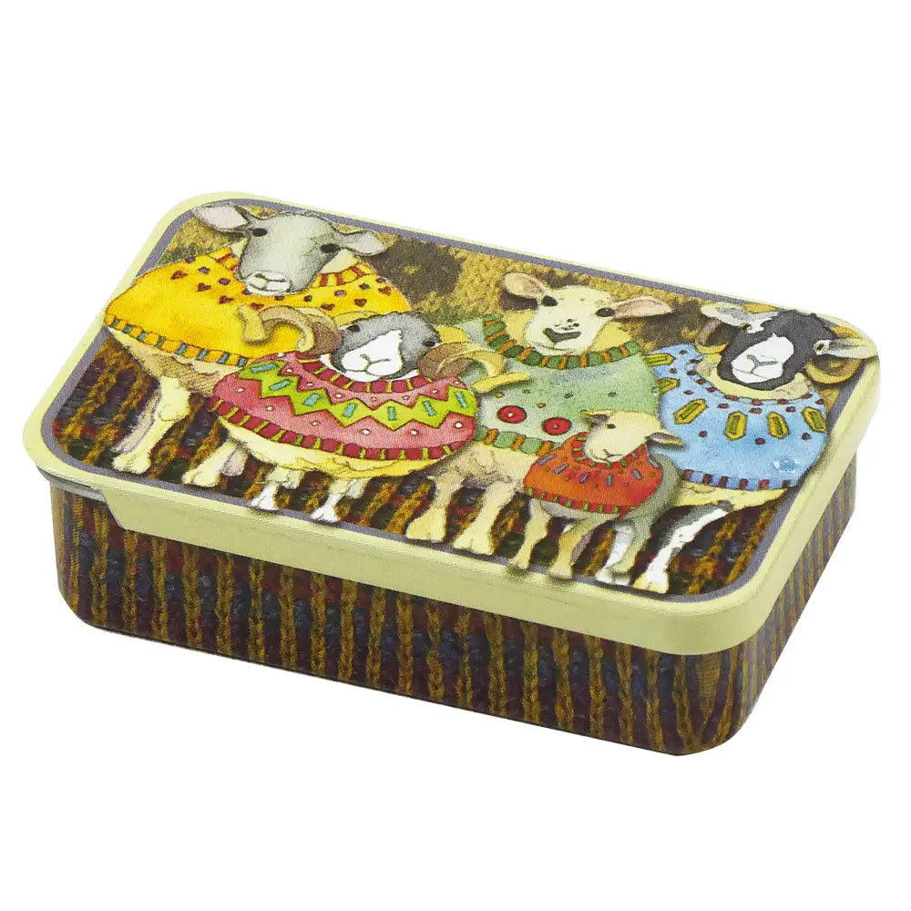 Miniature tin with sheep in sweaters design on knitted background and knitted stripes around the ages.